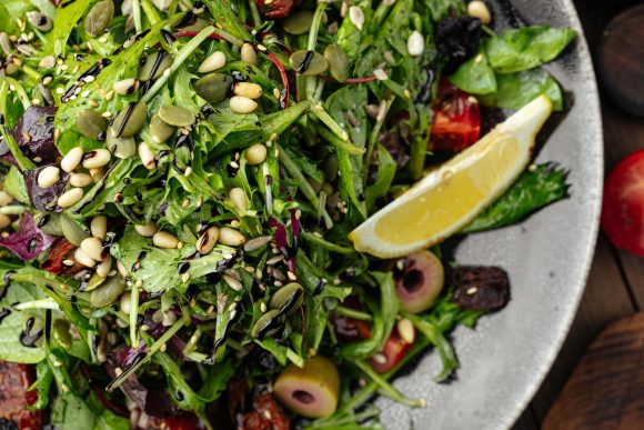 Green mediterranean salad with pine nuts