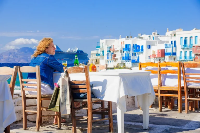 woman sitting in restaurant in mykonos